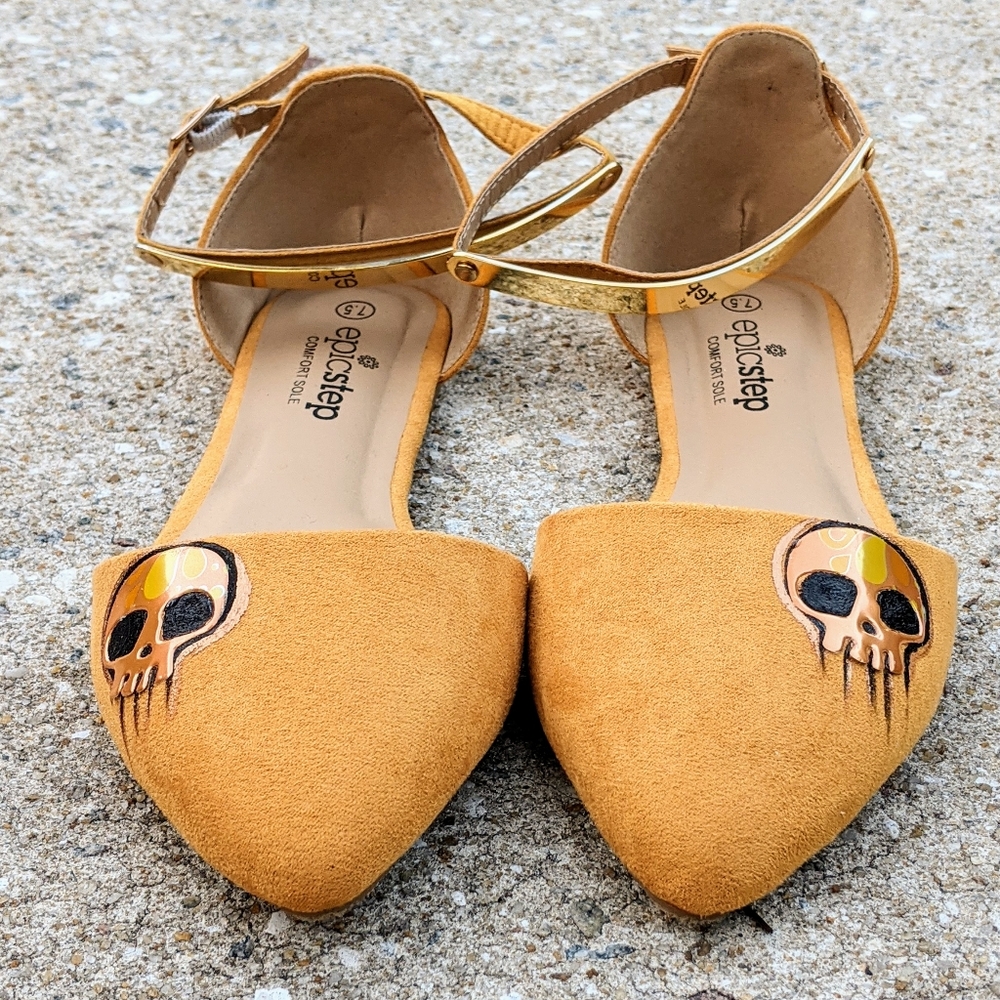 Pointy Gold Faux Suede Skull Strap Flats